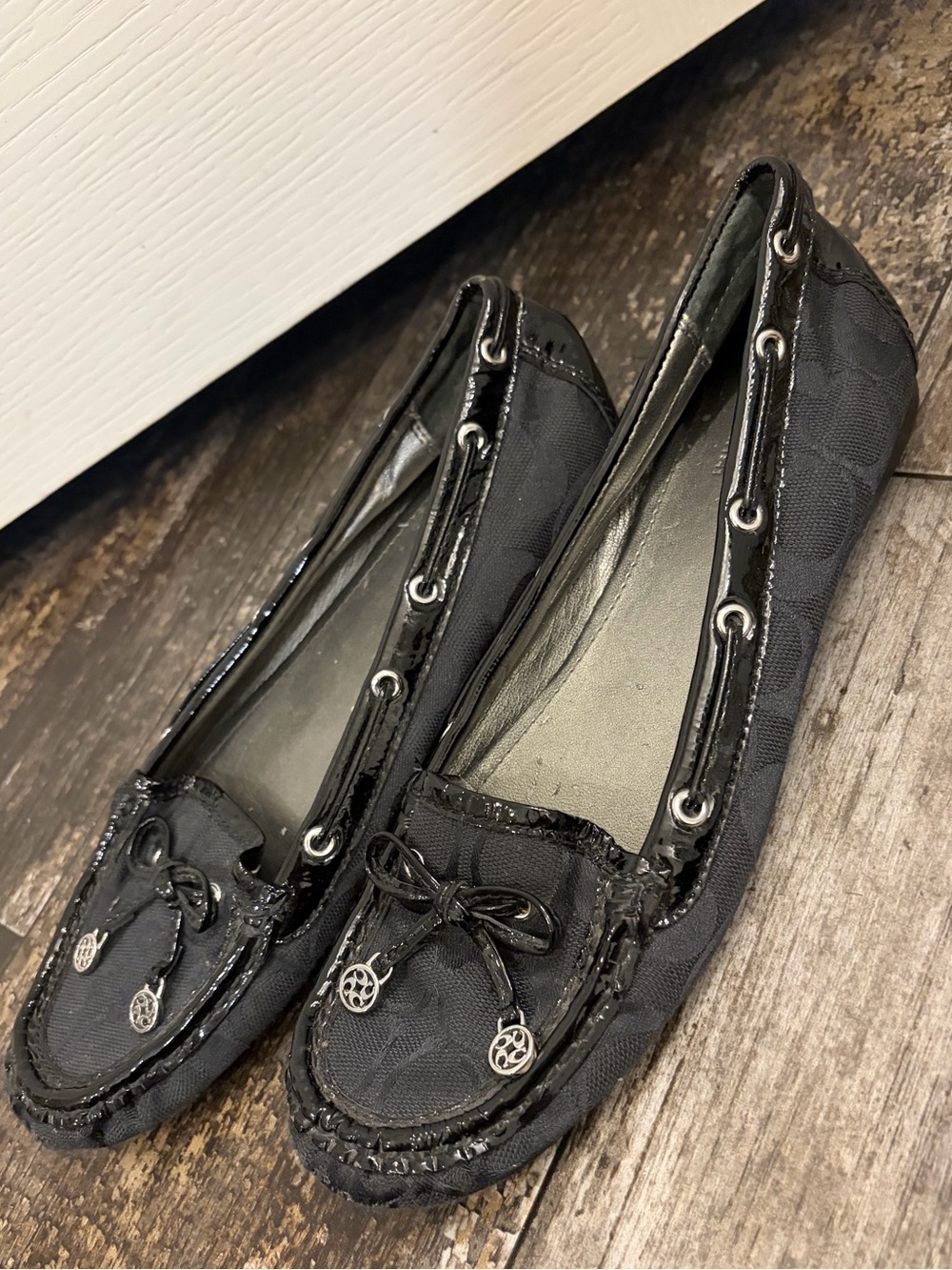 Coach Black Signature Moccasin Flats with Bow and Logo Charms